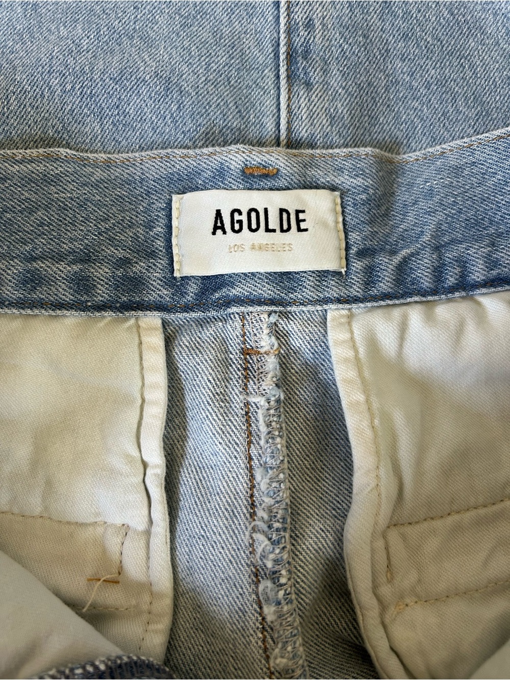 AGOLDE Light Wash Denim Mini Skirt Size 25 Raw Hem High Rise